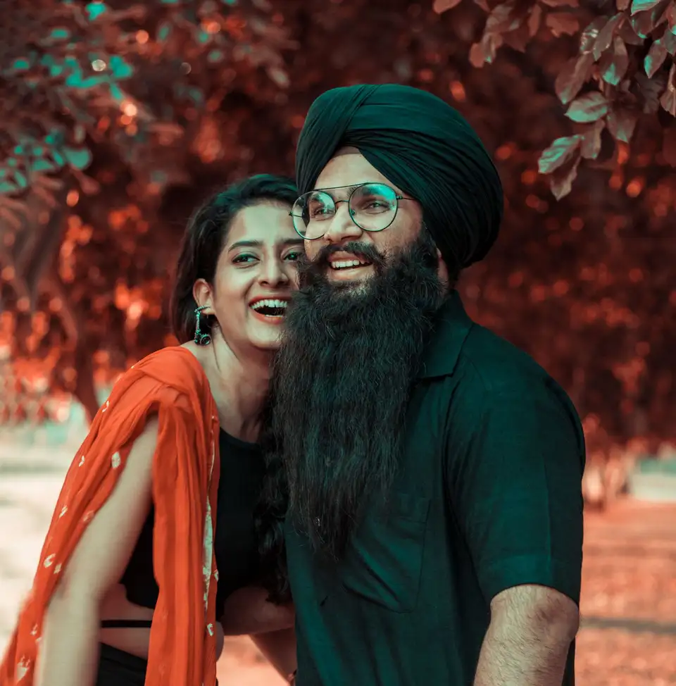 A bride and groom sharing a laugh